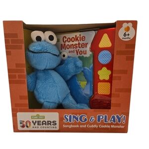 SING AND PLAY SONGBOOK AND CUDDLY COOKIE MONSTER. NEW IN BOX.